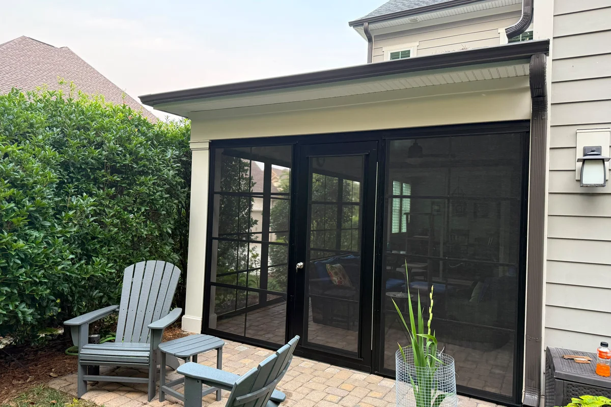 Completed 3-season vinyl film enclosure exterior view in Huntersville NC