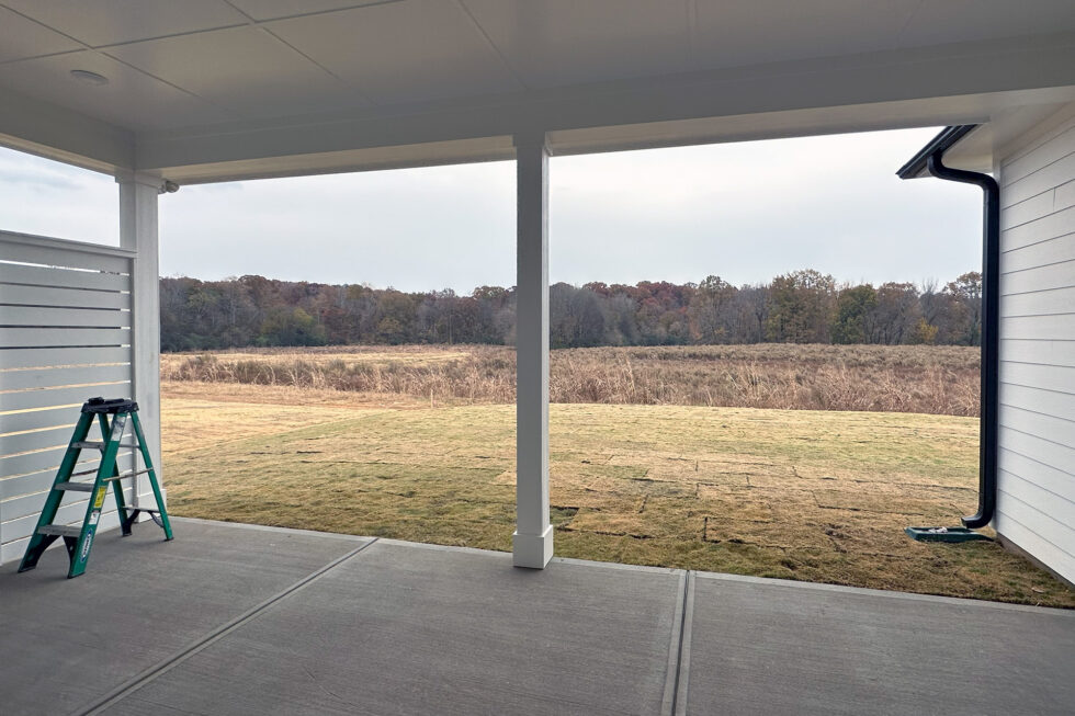 Waxhaw porch before vinyl-film 4-track window installation
