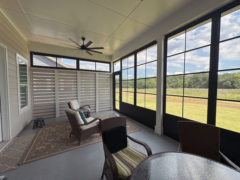 Interior close-up of sliding vinyl-film stacking windows