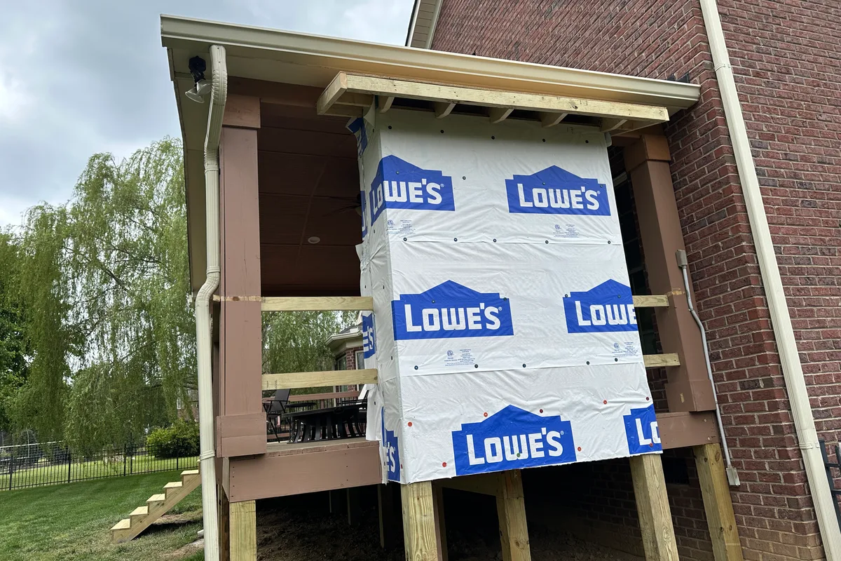 Glass porch enclosure installation underway Matthews NC residential