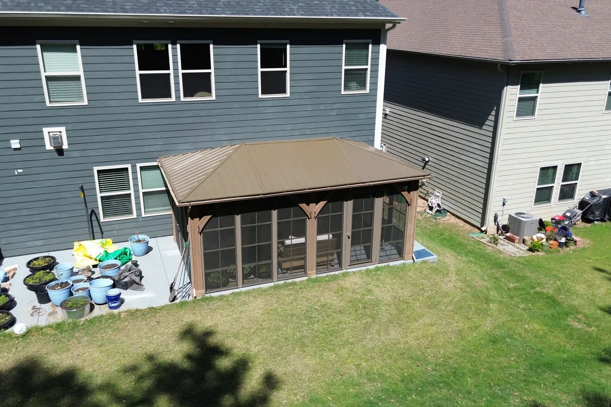 Vinyl film porch enclosure corner detail by Charlotte sunroom contractor