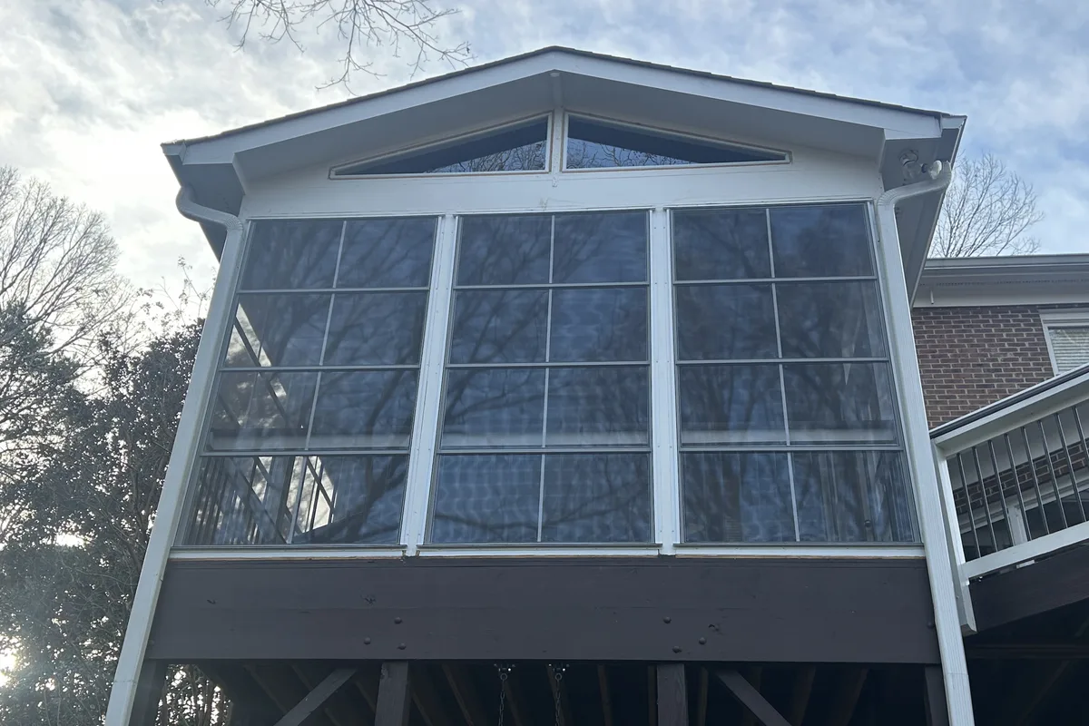 Completed vinyl film porch enclosure detail showing professional craftsmanship Charlotte NC